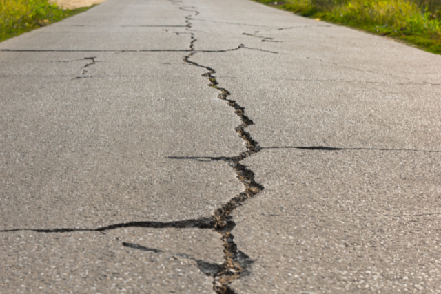 Surface of concrete driveway with crack